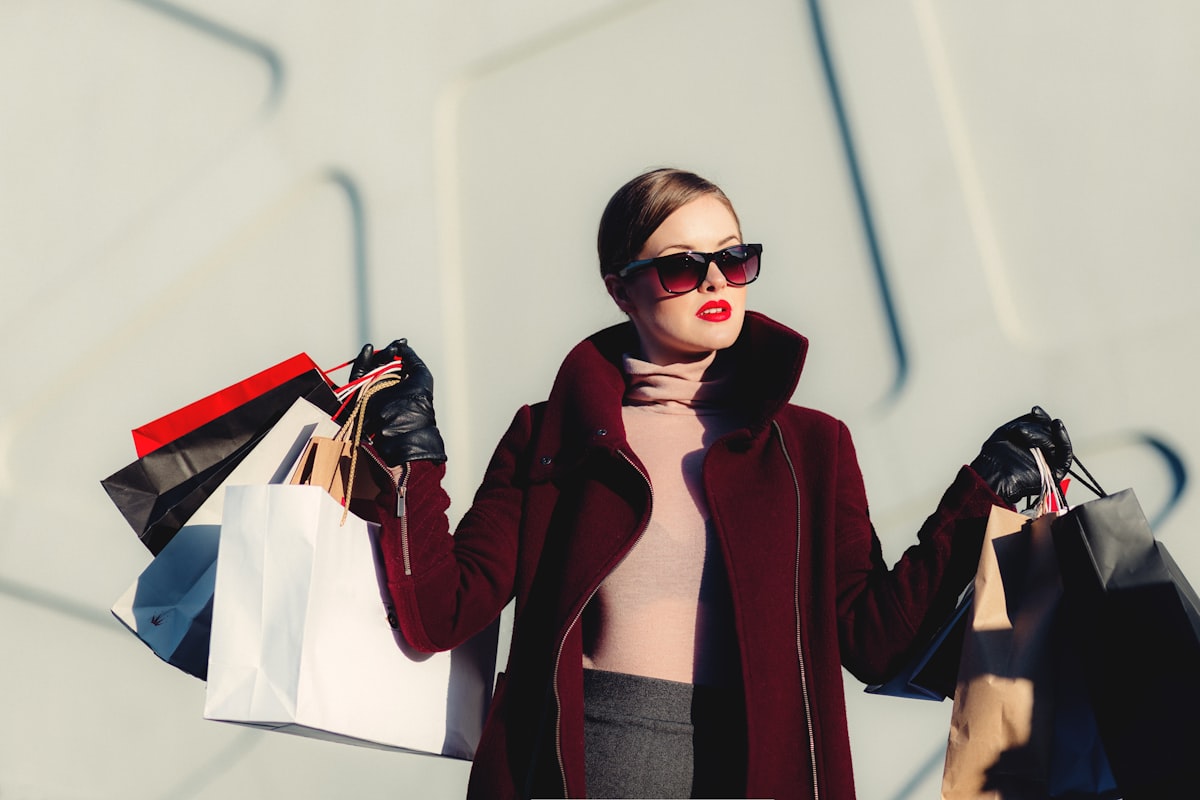 Shoppers browsing in a retail store with shopping bags