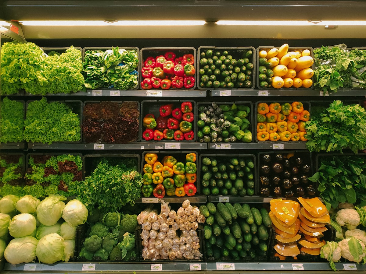 Person with shopping basket selecting products in a supermarket